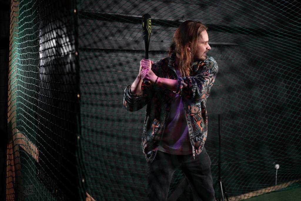 fun girl hitting ball in batting cage things to do southampton